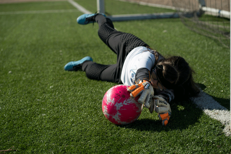 Athlete lying on ground in pain
