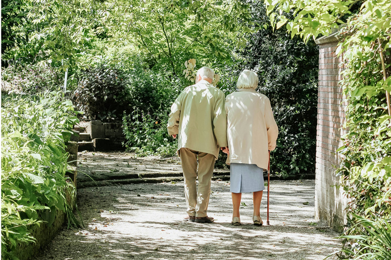 Old couple holding hands