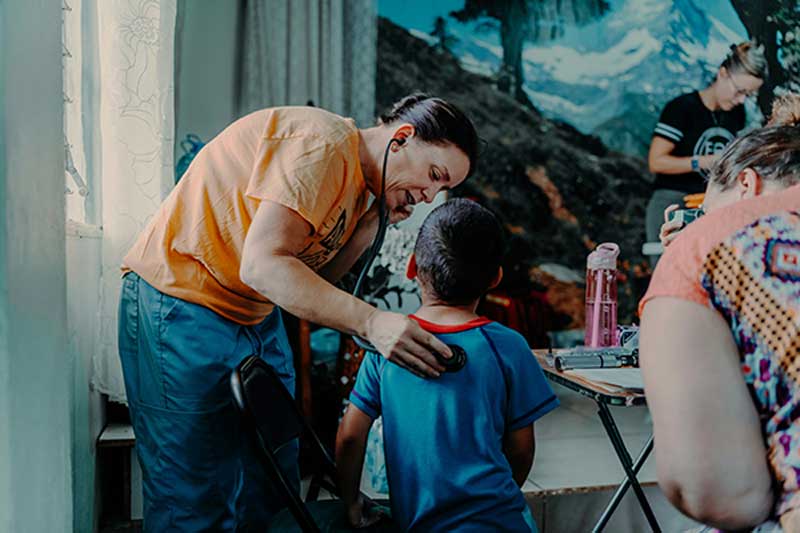 Doctor helping patient
