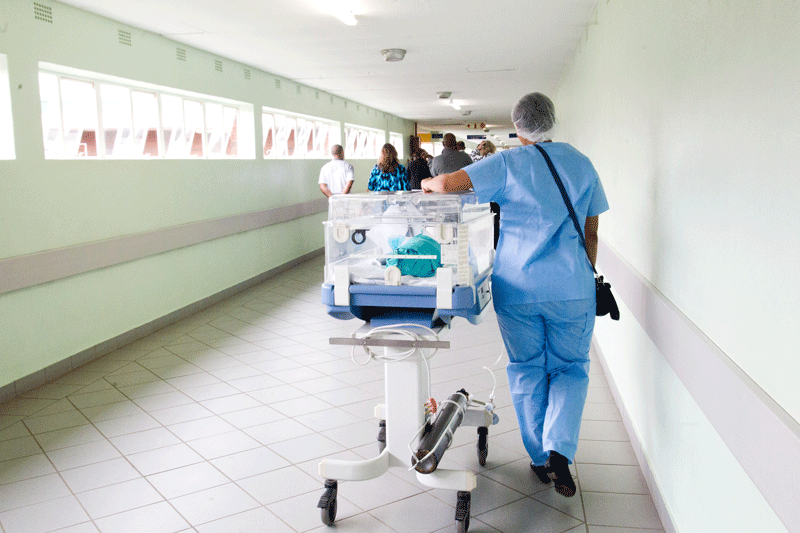 Wheeling a patient through the hospital