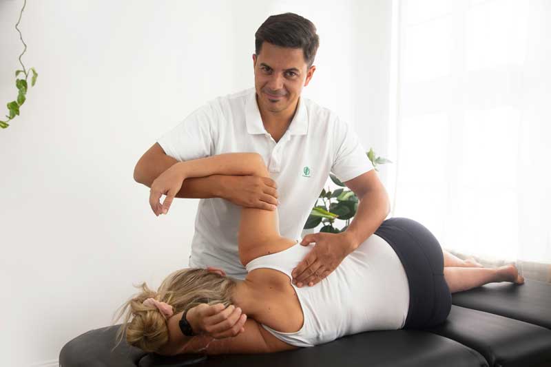 Physiotherapist treating patient