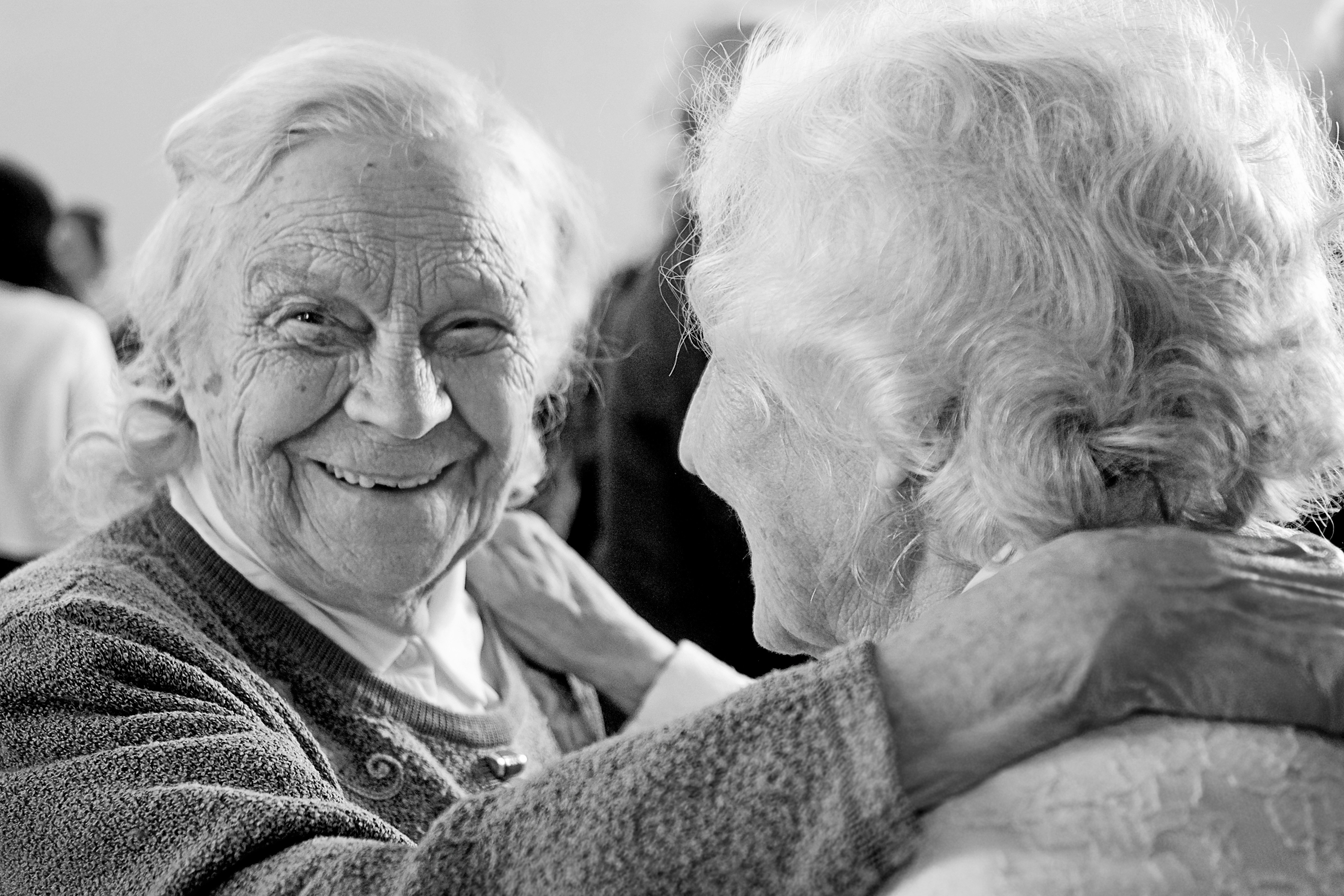 Two elderly people chatting